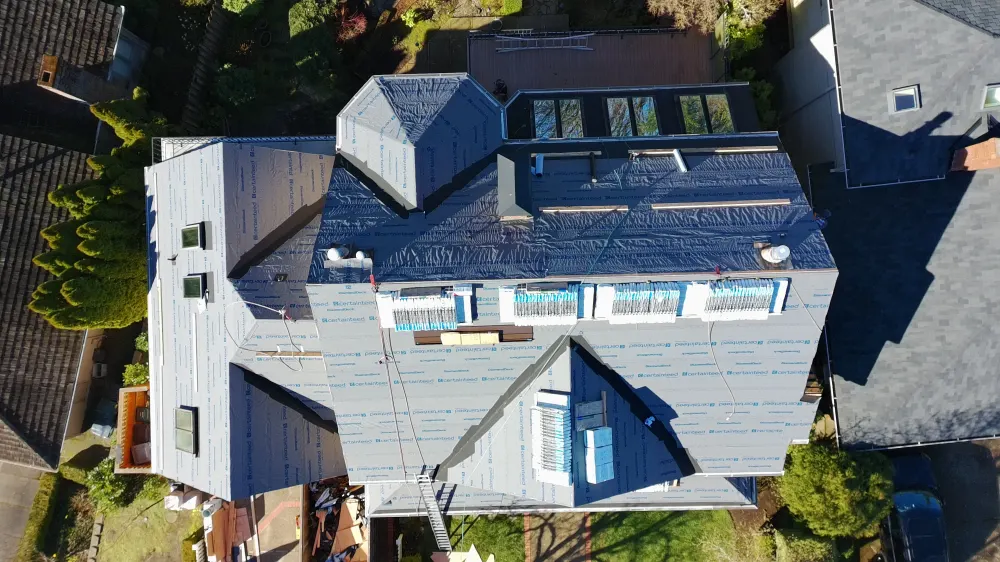 Roofing crew mid-installation